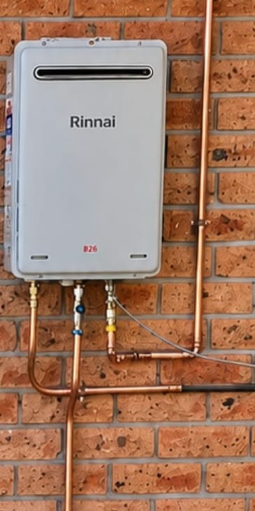 Wall-mounted instantaneous gas hot-water unit after installation